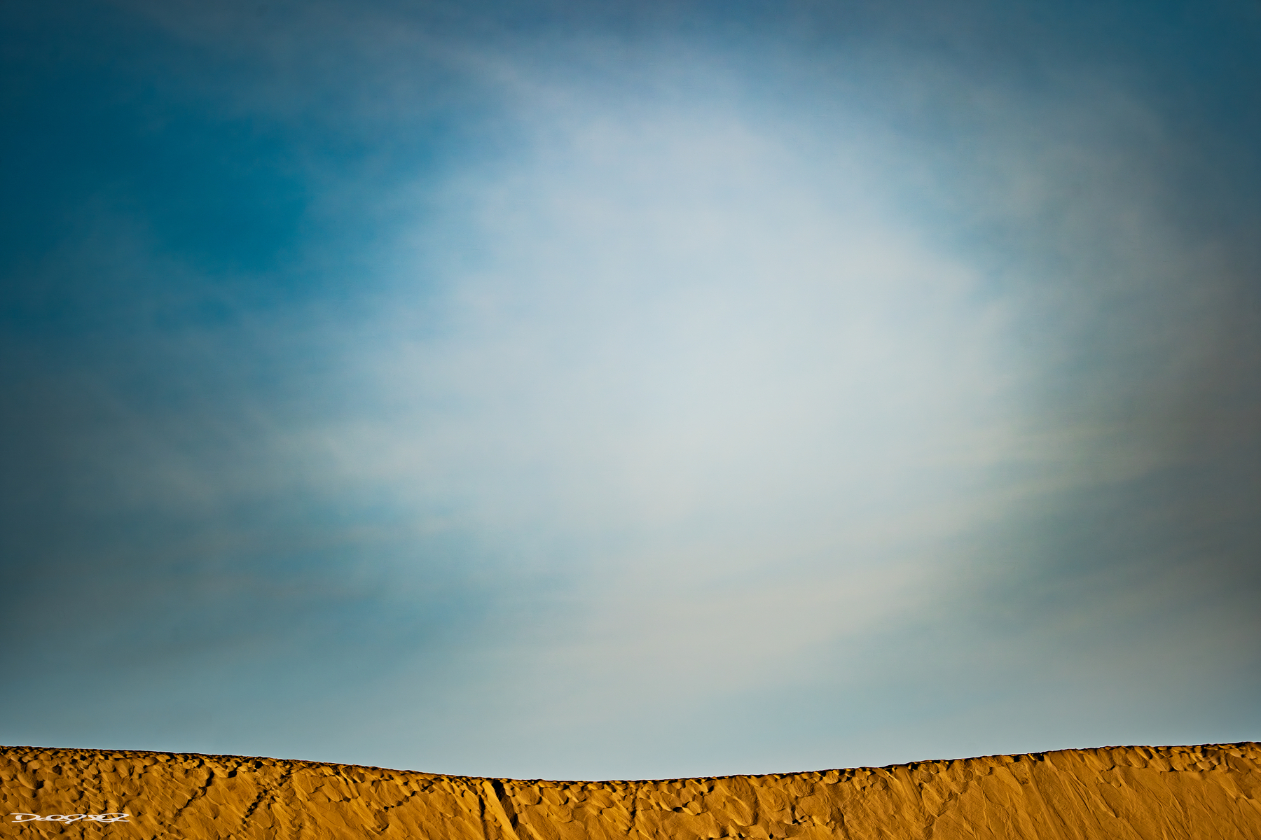 Cape Kiwanda dune ridge at Oregon's Pacific Coast lit by sunrise light.